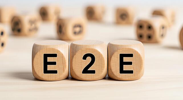 Wooden dice spelling E2E on a bright wooden surface representing endtoend encryption and solutions conveying a message of security technology and modern communication in a clean minimalist setting photo