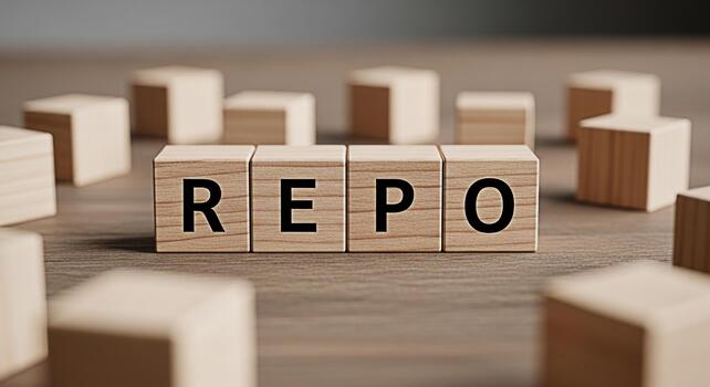 Wooden blocks spelling REPO on a wooden surface surrounded by other blocks representing financial repossession and the concept of reclaiming assets with a sense of seriousness and economic implication photo