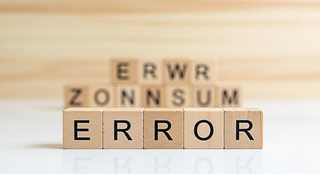 Wooden blocks spelling ERROR on a white surface representing system failure and technical problems conveying a sense of frustration and the need for troubleshooting in a digital environment photo