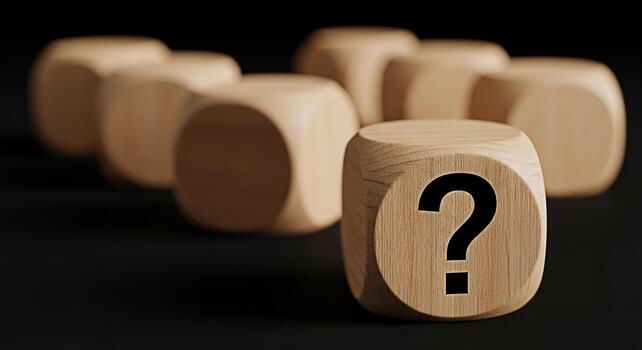 Wooden dice displaying a question mark on a dark surface symbolizing uncertainty and the need for answers in a business decisionmaking process fostering a sense of curiosity and problemsolving photo