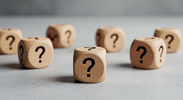 Wooden dice displaying question marks on a textured surface representing uncertainty and the need for answers in a complex problemsolving environment creating a mood of curiosity and inquiry photo