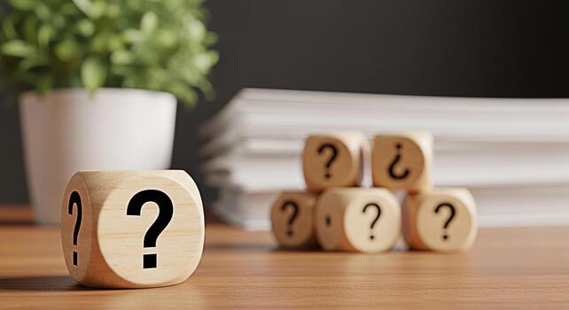 Wooden dice displaying question marks on a wooden desk in a bright office representing uncertainty problemsolving and the search for answers in business and personal life fostering curiosity photo