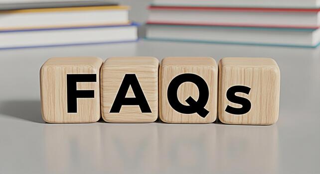 Wooden blocks displaying FAQs on a neutral surface with books in the background representing information access and customer support in a clear and concise manner conveying a sense of helpfulness and photo