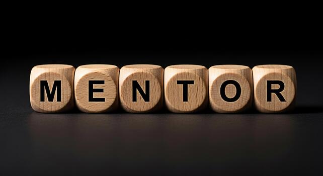 Wooden blocks spelling MENTOR on a dark surface symbolizing guidance and support creating a motivational and inspirational atmosphere for personal and professional development photo