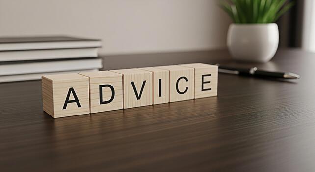 Wooden blocks spelling ADVICE on a desk offering guidance and support in a professional setting creating a sense of trust and reliability for business solutions and personal growth photo