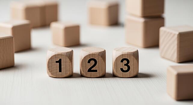 Wooden blocks displaying numbers 1 2 and 3 on a white surface representing a simple counting concept and a playful learning environment for children fostering early education and numerical literacy photo