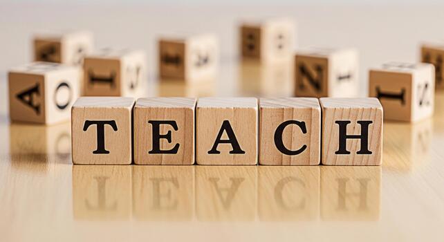 Wooden blocks spelling TEACH on a reflective surface symbolizing education and learning in a classroom environment conveying a message of knowledge and academic success photo