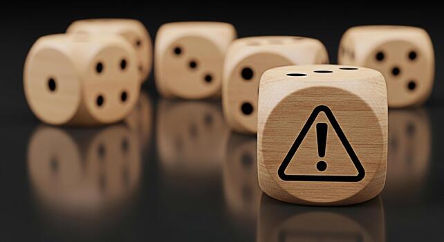 Wooden dice with an exclamation mark on a dark reflective surface symbolizing risk and uncertainty in games of chance business decisions and potential dangers creating a sense of caution and awareness photo