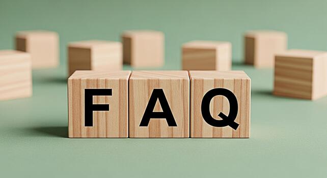 Wooden blocks displaying FAQ on a green surface representing information access and problemsolving with a focus on clarity and helpfulness in a simple minimalist setting photo