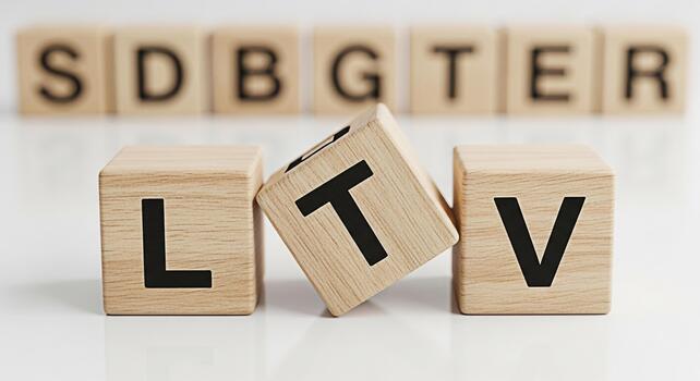 Wooden blocks displaying LTV and SDBGTER on a white surface representing customer lifetime value in a business setting conveying a message of growth and longterm success photo