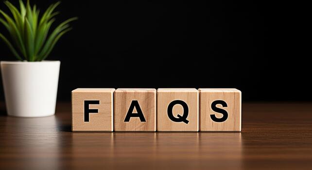 Wooden blocks spelling FAQs on a wooden table in a dark setting representing frequently asked questions and information access conveying clarity and helpfulness for customer support and online assista photo