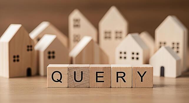 Wooden blocks spelling QUERY in a miniature wooden house village representing real estate questions and information creating a sense of curiosity and the need for answers in property investment photo