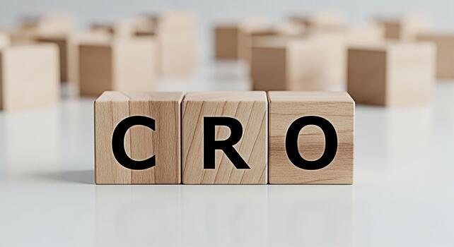 Wooden blocks displaying CRO on a white surface representing Conversion Rate Optimization in a clean minimalist setting symbolizing business growth and marketing strategy with a focus on efficiency an photo