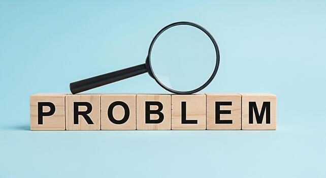 aumentador vaso examinando el palabra problema espelta fuera con de madera bloques en contra un ligero azul antecedentes simbolizando análisis investigación y el buscar para soluciones a complejo cuestiones foto