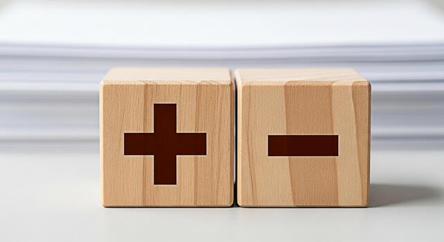 Wooden blocks displaying plus and minus signs on a white surface representing choices and decisions in a bright clean environment symbolizing balance opposites and the process of weighing pros and con photo