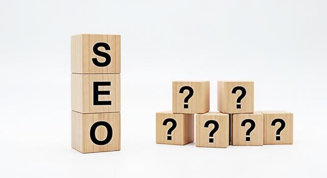 Wooden blocks spelling SEO standing next to question mark blocks on a white background representing search engine optimization questions and the need for answers in the digital marketing landscape photo