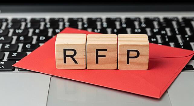 Wooden blocks spelling RFP on a red envelope placed on a laptop keyboard symbolizing a formal request for proposal in a modern business environment conveying professionalism and opportunity photo