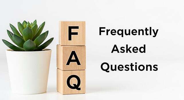 Stack of wooden FAQ blocks next to a potted succulent plant on a white surface representing information and support with a clean and modern aesthetic for business and customer service concepts photo