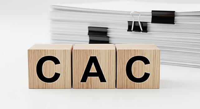 Wooden blocks displaying CAC in a bright studio setting representing cost accounting and compliance emphasizing financial responsibility and meticulous recordkeeping for business success and transpare photo
