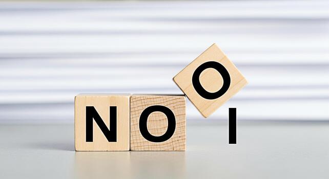 Wooden blocks spelling NO being transformed to ON in a bright studio setting symbolizing change positivity and the power of perspective representing a shift in mindset and embracing new opportunities photo