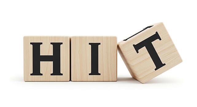Wooden blocks spelling out the word HIT on a white surface symbolizing success and achievement in a clean minimalist environment conveying a message of target accomplishment and positive results photo