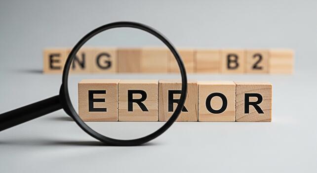 Magnifying glass inspecting wooden blocks spelling ERROR on a gray surface symbolizing problem identification and quality control in a minimalist and focused environment highlighting the importance of photo