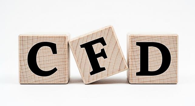 Wooden blocks spelling CFD on a white surface representing Contracts for Difference a popular trading instrument conveying a message of financial markets and investment opportunities in a simple clean photo