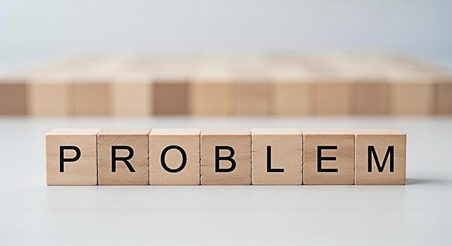 Wooden blocks spelling PROBLEM on a white surface representing challenges and difficulties in a clean minimalist setting conveying a sense of analysis and solutionseeking photo