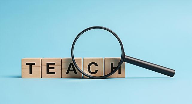 Wooden blocks spelling TEACH under a magnifying glass on a light blue background symbolizing education learning and the importance of teachers in a bright and optimistic setting photo