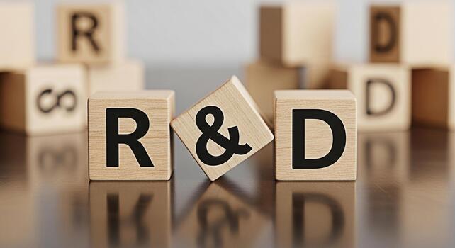 Wooden blocks displaying RD on a reflective surface representing research and development in a corporate setting symbolizing innovation and strategic planning for business growth and success photo