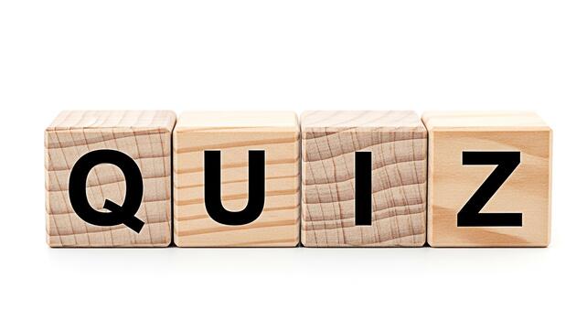 Wooden blocks spelling QUIZ on a white surface promoting knowledge assessment and learning in an educational setting creating a playful and engaging atmosphere for students and educators alike photo