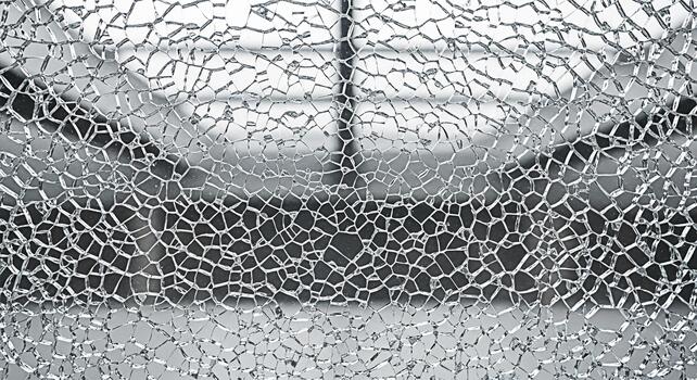 Cracked glass shatters in a modern building creating a sense of fragility and vulnerability symbolizing accidents damage and the need for repair and safety measures in urban environments photo