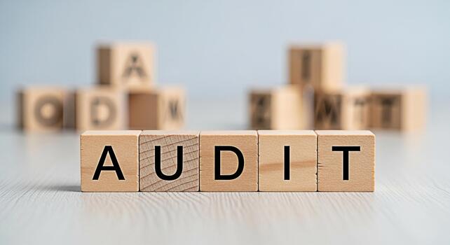 Wooden blocks spelling AUDIT on a bright table symbolizing financial review and business compliance creating a sense of accountability and transparency in a corporate environment photo