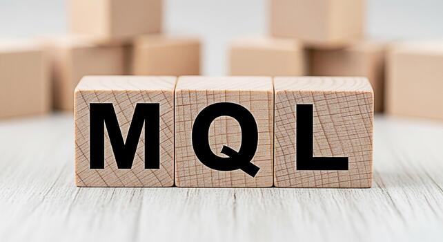 Wooden blocks displaying MQL on a white wooden surface representing marketing qualification in a clean and minimalist setting conveying a message of clarity and strategic business development photo