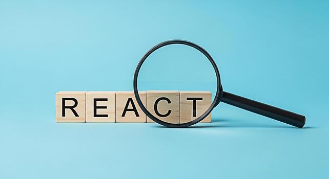 Magnifying glass inspecting wooden blocks spelling REACT on a blue background symbolizing code review debugging and the importance of frontend web development frameworks in a modern tech environment photo