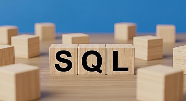 Wooden blocks displaying the letters SQL on a wooden surface against a blue background representing database management and structured query language concepts for software development and data analysi photo