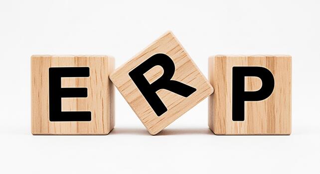Wooden blocks spelling ERP on a white surface illustrating enterprise resource planning and business management conveying efficiency and organization in a clean minimalist setting photo