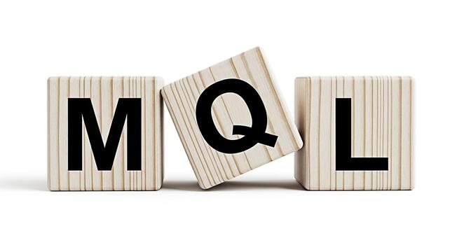 Wooden blocks displaying MQL acronym in a clean white studio setting representing marketing qualified leads and the importance of lead generation and qualification in modern business and digital marke photo