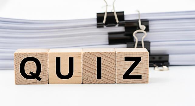 Wooden blocks spelling QUIZ in a bright organized office environment representing knowledge assessment and learning suggesting a fun and engaging educational experience with a focus on testing skills photo