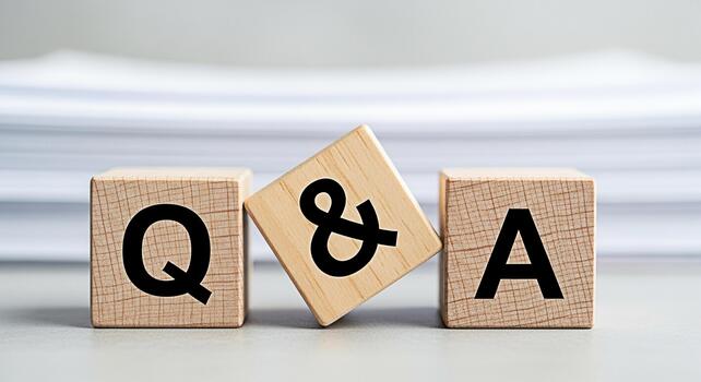 Wooden blocks displaying QA on a neutral surface representing questions and answers in a corporate setting fostering a sense of clarity and information exchange for business and education purposes photo