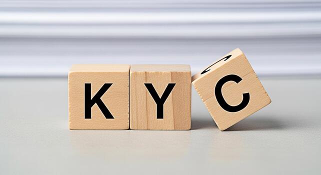 Wooden blocks spelling KYC on a neutral surface symbolizing compliance and identity verification in a financial or business setting conveying trust and regulatory adherence photo