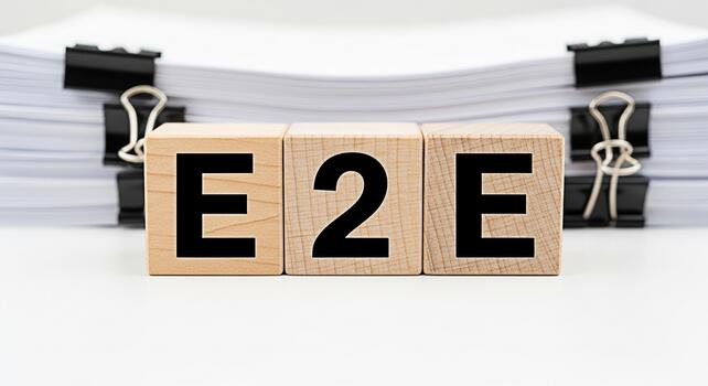 Wooden blocks displaying E2E in a bright office environment symbolizing endtoend solutions and efficient processes conveying a message of comprehensive service and seamless integration for business su photo