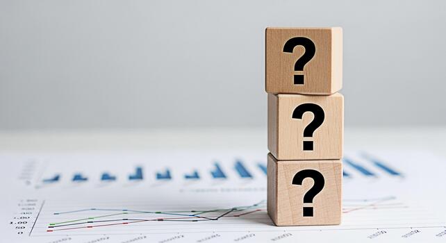 Stacked wooden blocks displaying question marks on a financial chart representing uncertainty in business analytics and investment decisions creating a mood of inquiry and problemsolving in a corporat photo
