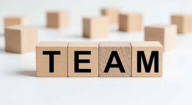 de madera bloques ortografía equipo en un blanco superficie simbolizando colaboración y unidad en un negocio ambiente Fomentando un sentido de trabajo en equipo y compartido éxito promoviendo un positivo y apoyo Atmósfera foto