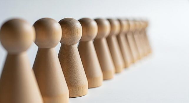 alineado de madera empeñar cifras en pie en un fila en un blanco superficie representando trabajo en equipo unidad y estratégico planificación en un minimalista y limpiar estudio ajuste transporte un sentido de orden y colaboración foto