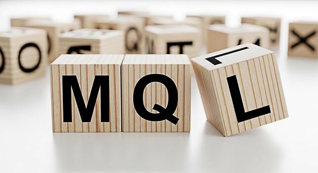 Wooden blocks spelling MQL on a white surface representing marketing qualification in a clean and minimalist setting conveying a sense of precision and strategic marketing focus photo