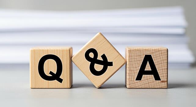Wooden blocks displaying Q A on a neutral surface symbolizing questions and answers representing knowledge sharing and problemsolving in a bright and clean office environment promoting clarity and und photo