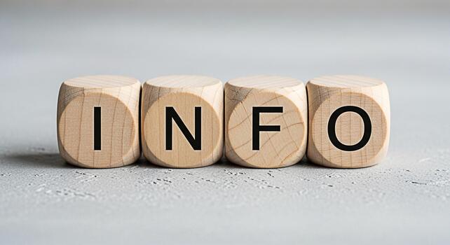 Wooden blocks displaying the word INFO on a textured gray surface representing knowledge and data in a simple and clear presentation conveying a sense of clarity and accessibility of information photo