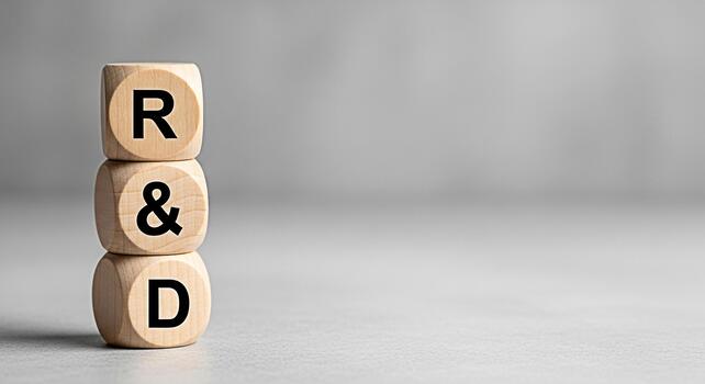 Stacked wooden blocks displaying RD in a neutral studio environment symbolizing research and development innovation and strategic planning for business growth and technological advancement photo