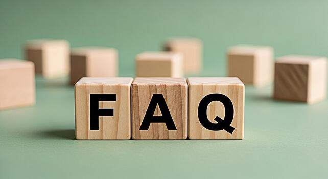 Wooden blocks displaying FAQ on a green surface representing frequently asked questions and providing information creating a sense of clarity and guidance for users seeking answers photo
